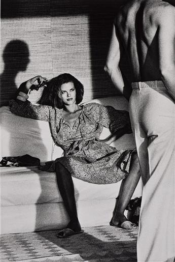 HELMUT NEWTON (1920-2004) Woman examining man, from American Vogue, St. Tropez.                                                                  